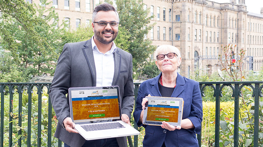 Jag Panesar and Ros Garside showing off the Saltaire Festival website